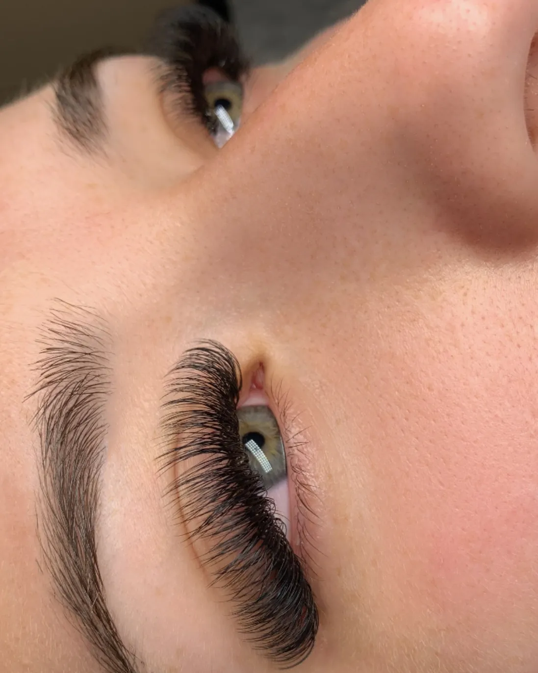 Half-finished volume lash set showing the before and after on one face, Brooklyn