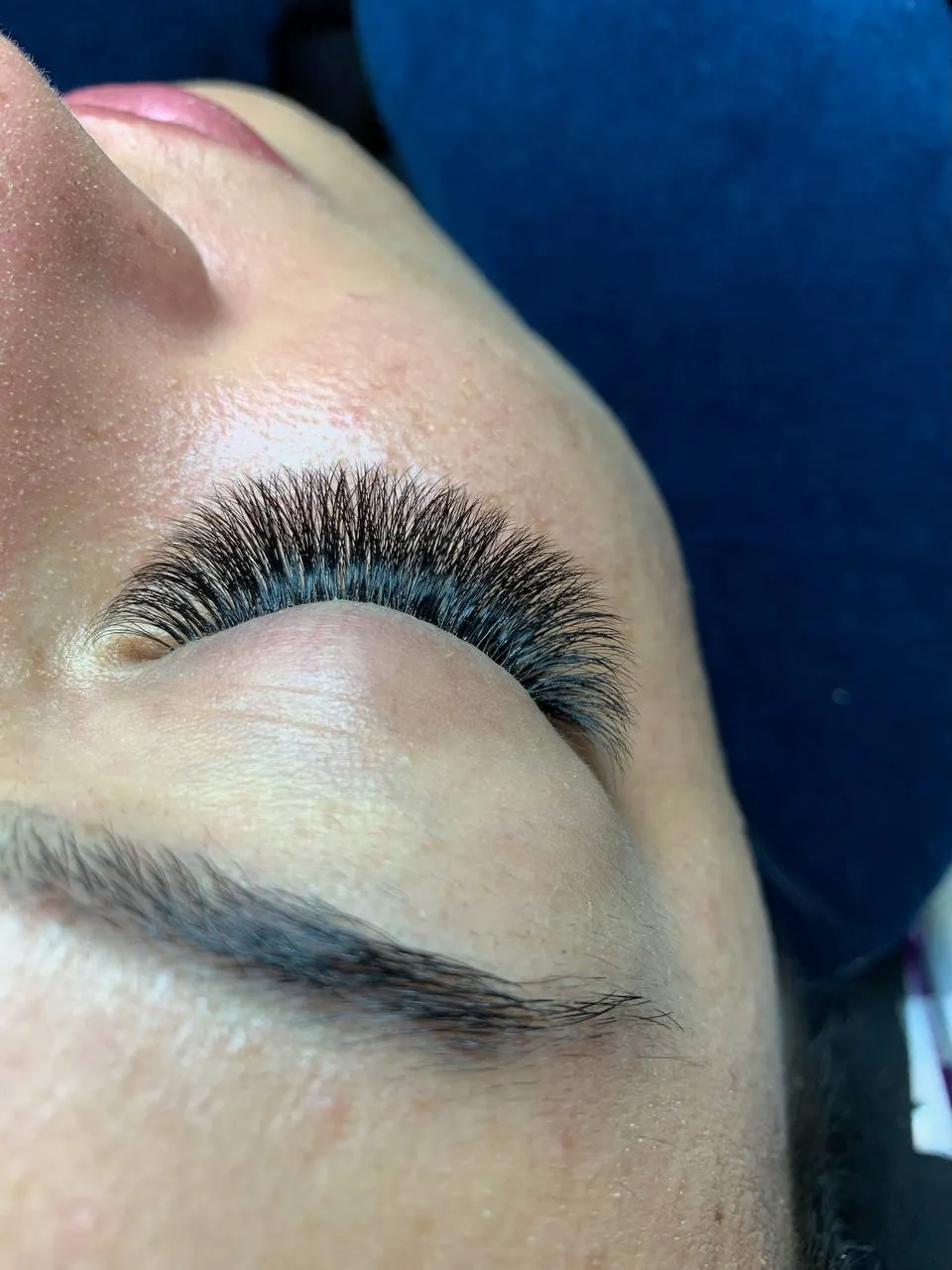 Closed eye showing wispy spike placement along the lash line, Brooklyn